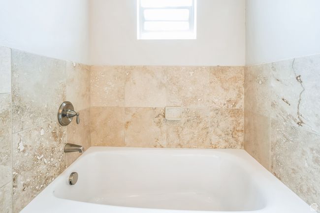 Full bath featuring a bath | Image 17
