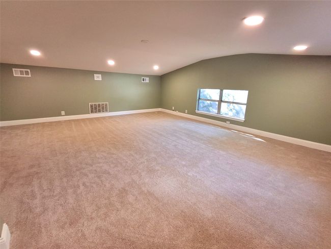 Carpeted Bonus room with vaulted ceiling, baseboards, and recessed lighting | Image 11