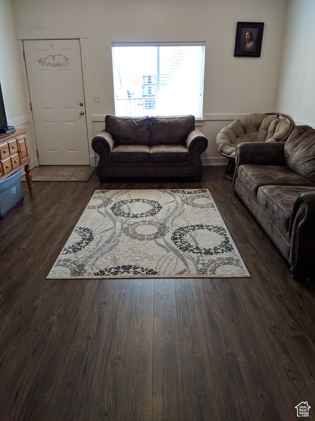 Living area with dark wood finished floors | Image 4