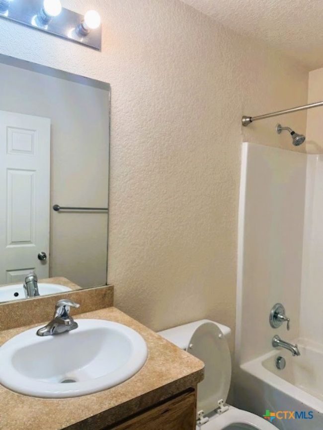 Nice bathroom with plenty of space. | Image 18