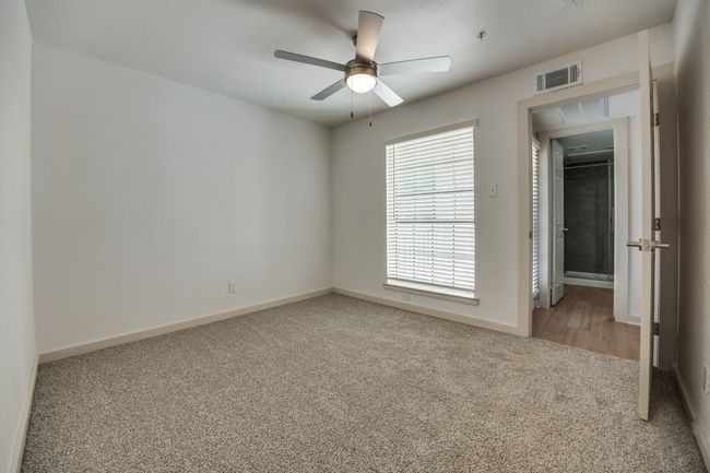 Carpeted spare room with ceiling fan | Image 20