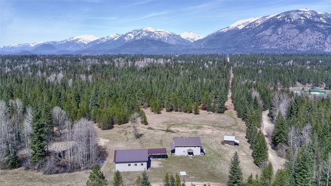 Birds eye view of property with a view of trees and a mountain view | Image 10