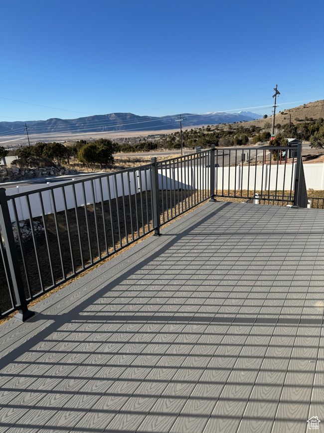 Wooden terrace featuring a mountain view | Image 6