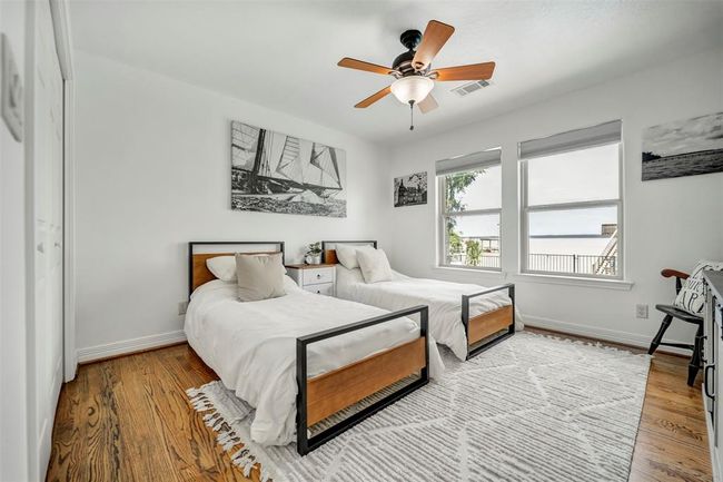 Secondary bedroom fits 2 twin beds with a stunning view of Lake Livingston | Image 30