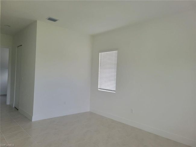 Empty room with baseboards | Image 11