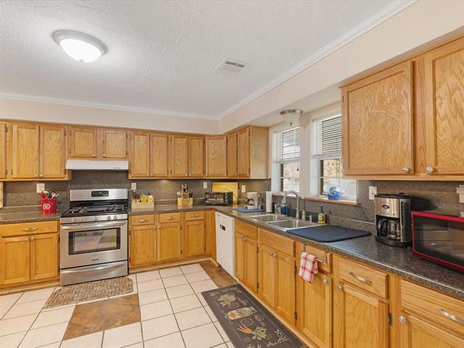 Solid oak cabinets, tile flooring... | Image 11