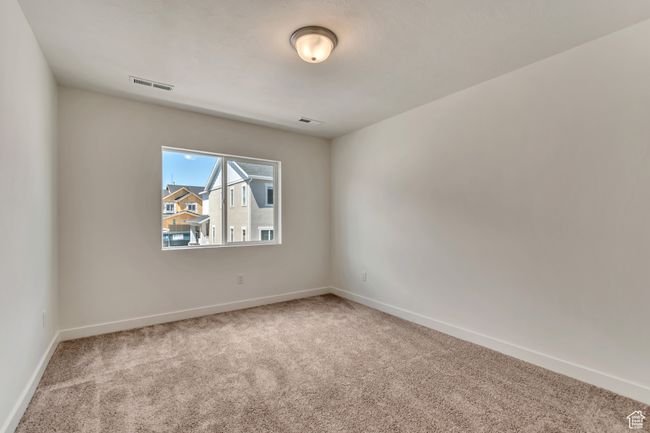 Empty room featuring baseboards, visible vents, and carpet floors | Image 11
