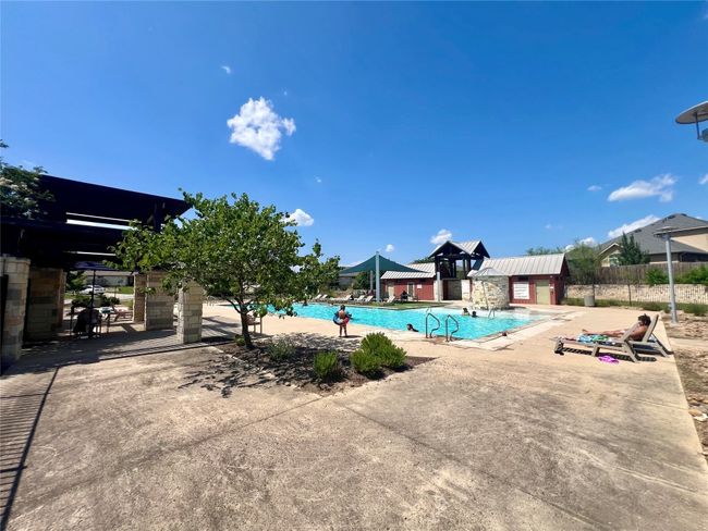 Community pool featuring a patio area | Image 38
