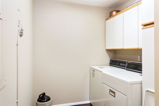 Laundry room with cabinet space and washing machine and dryer | Image 52