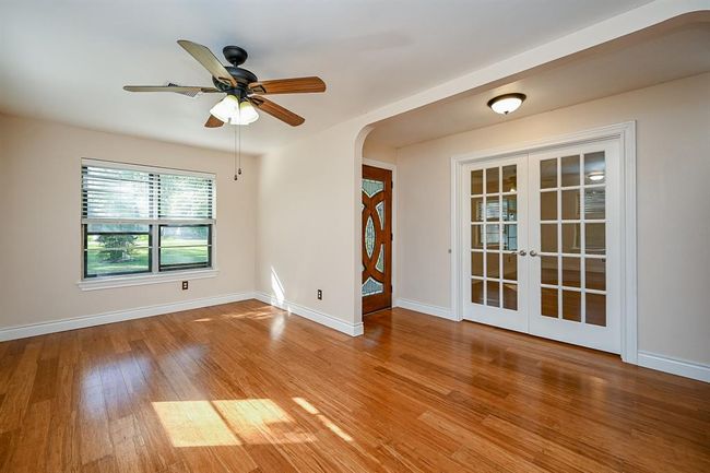 View from the front entry. French doors lead to the large bonus room. | Image 7