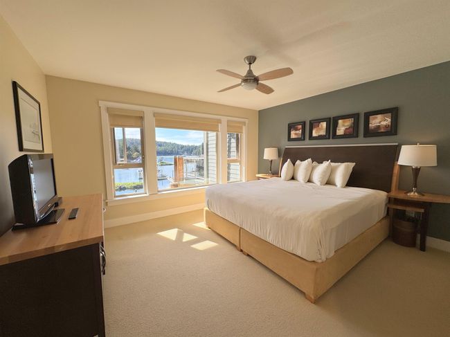 Bedroom featuring carpet flooring and ceiling fan | Image 21