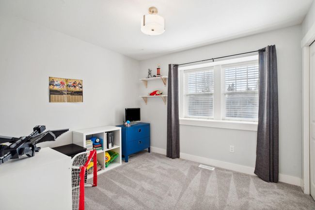 Playroom with carpet flooring, baseboards, and visible vents | Image 26