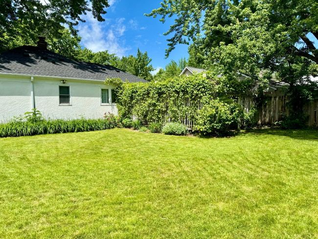 The patio in the backyard provides a perfect shaded retreat for enjoying the outdoors. | Image 24