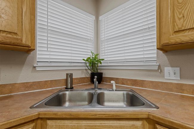 Room details with a sink and a textured wall | Image 20