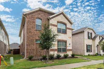 View of front facade featuring central air condition unit and a front yard | Image 2