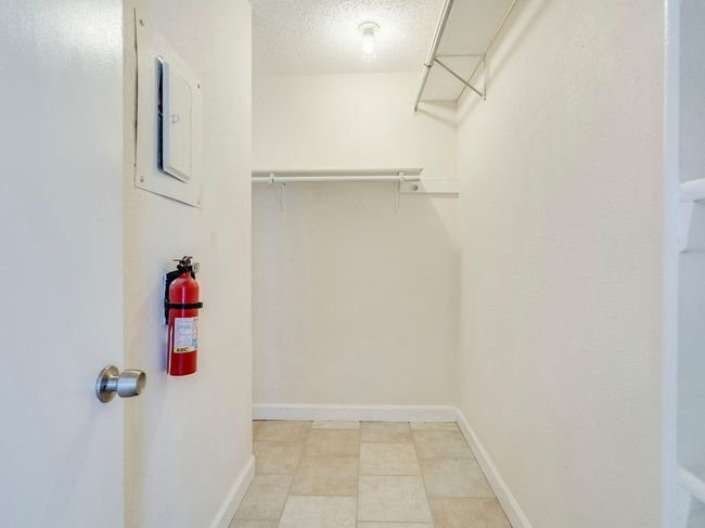 Spacious closet featuring electric panel | Image 12
