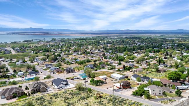 Drone / aerial view featuring a water and mountain view and a residential view | Image 40
