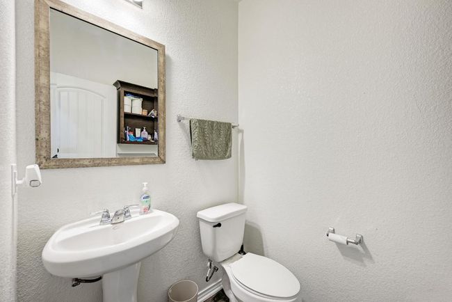 Bathroom with a sink and toilet | Image 21
