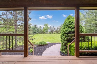 Wooden terrace featuring a yard | Image 3