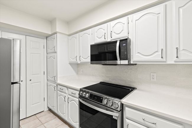 New quartz countertops with plenty of prep space for cooking | Image 15