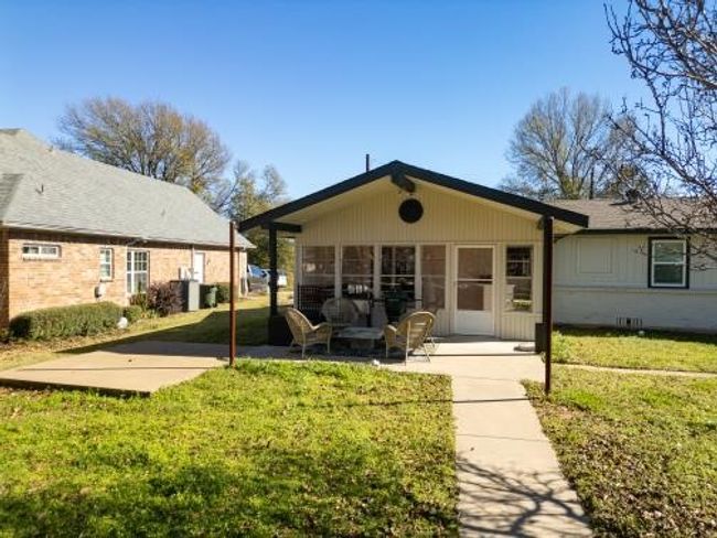 Rear view of house featuring a patio area and a yard | Image 12