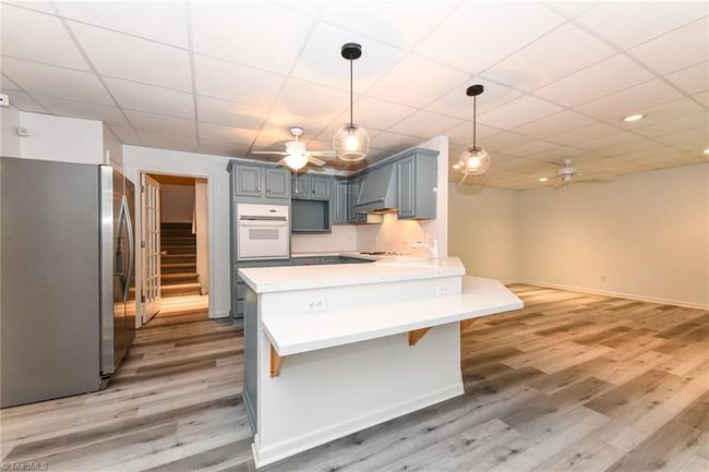 Hard to find these days is a move-in ready basement apartment. This home has it all! | Image 30