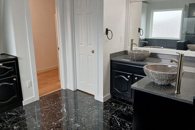 Full bathroom featuring double vanity and baseboards | Image 31