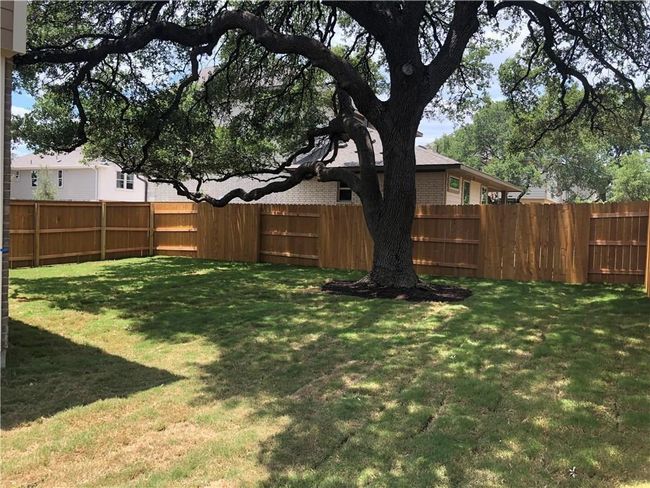 View of fenced backyard | Image 26