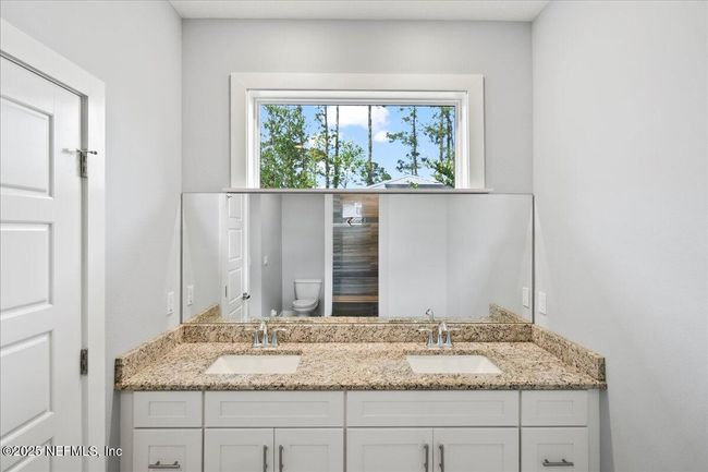 primary bath double vanity with window for plenty of light | Image 19