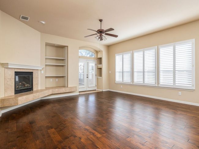 The living room opens to the back patio. | Image 10