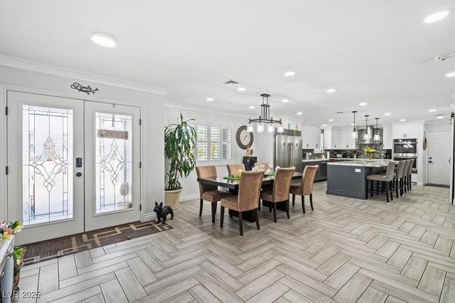 Dining room featuring recessed lighting, visible vents, crown molding, and french doors | Image 8