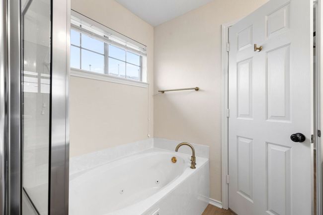 Bathroom featuring a whirlpool tub | Image 5