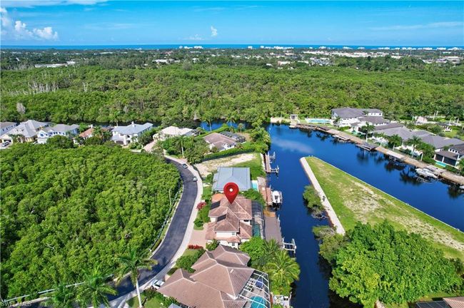 Birds eye view of property featuring a wooded view, a water view, and a residential view | Image 35