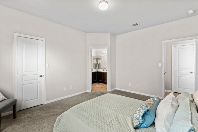 Primary bedroom, walk in closet on left, primary bathroom straight ahead. | Image 15