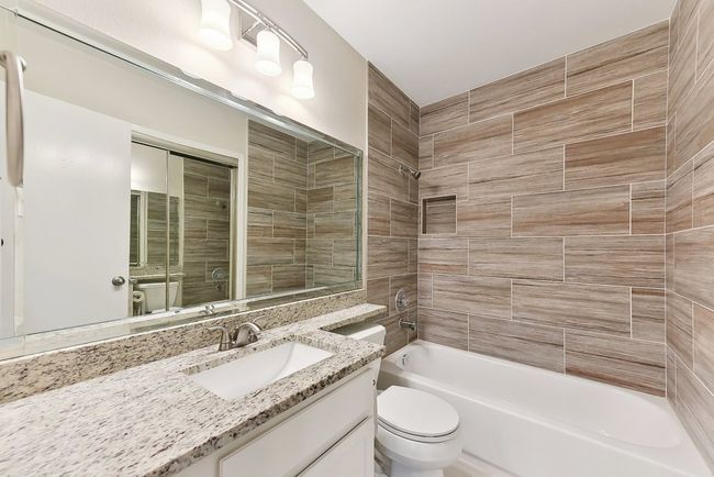 Full bathroom with shower / tub combination, toilet, and vanity | Image 19