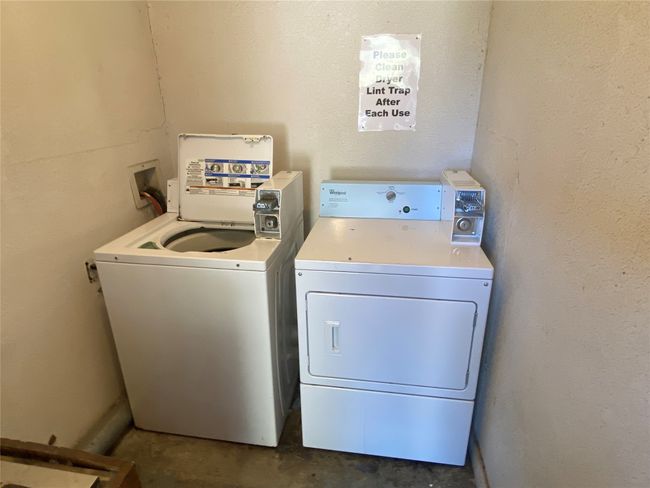 This apartment is equipped with a shared laundry space, convenient to the whole complex. | Image 8