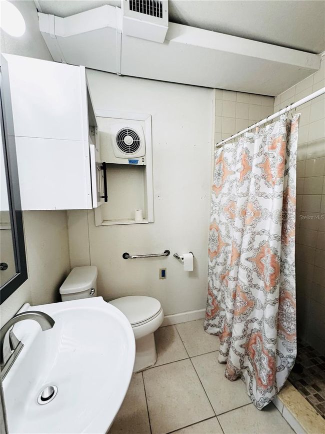 bathroom at front of the gouse off the living room and bedroom | Image 35