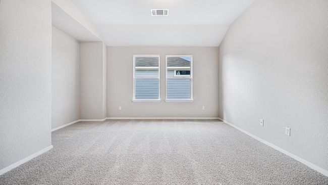 Spare room with carpet flooring, a textured wall, and lofted ceiling | Image 8