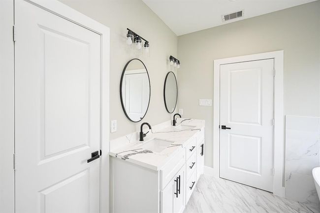 Double Mirrors Above The Bathroom Counter With Double Sinks & With Spacious Cabinet Space Underneath To Tuck Away Your Toiletries | Image 25