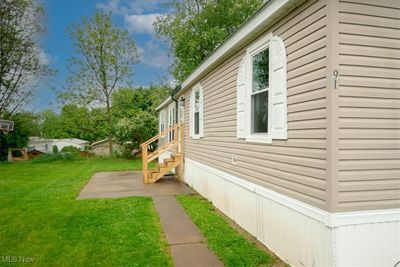 View of property exterior featuring a lawn | Image 3