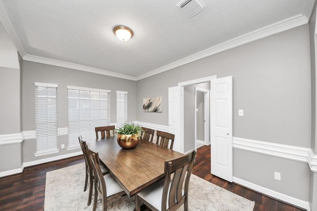 Dining Room with double door to cut through to the kitchen. | Image 5