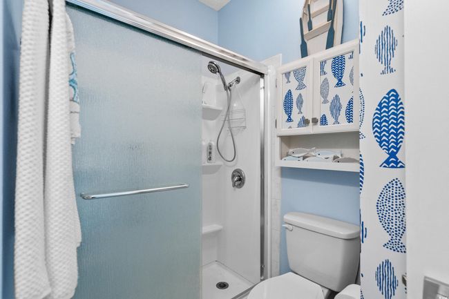 Full bathroom with toilet and a shower stall | Image 29