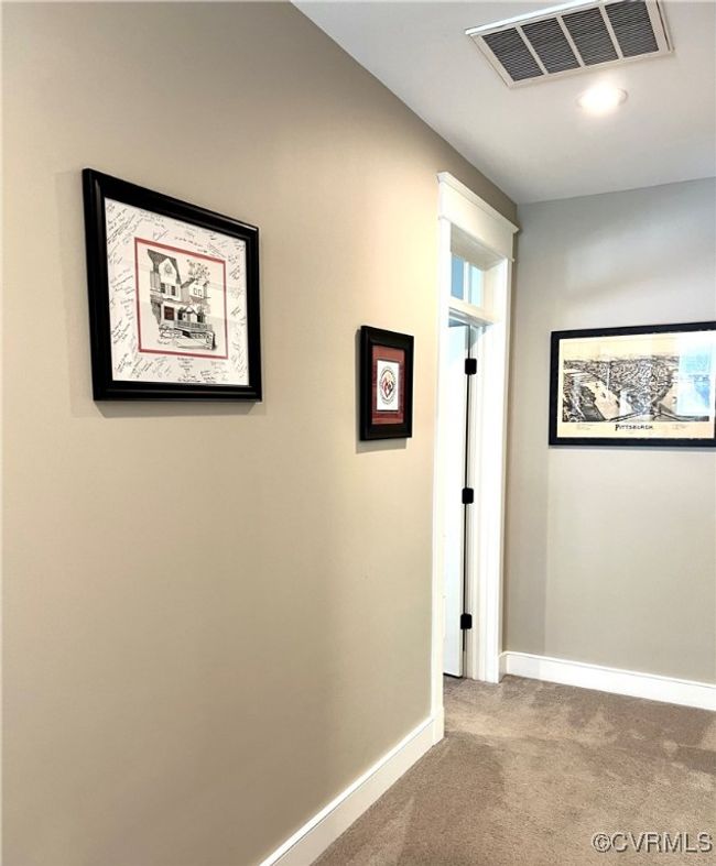 Hall featuring carpet flooring and baseboards | Image 26