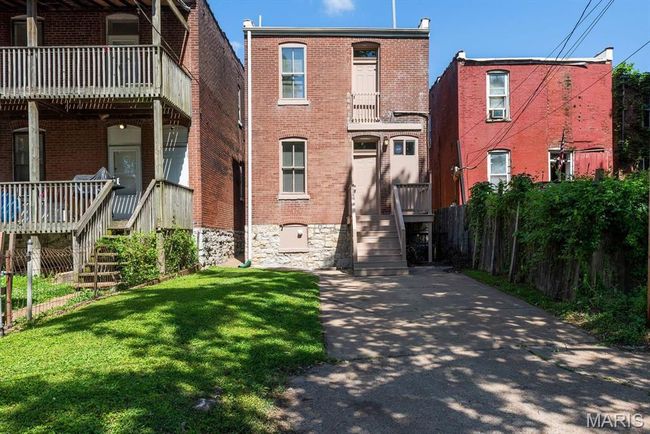 View of front of home with brick siding and stairs | Image 4
