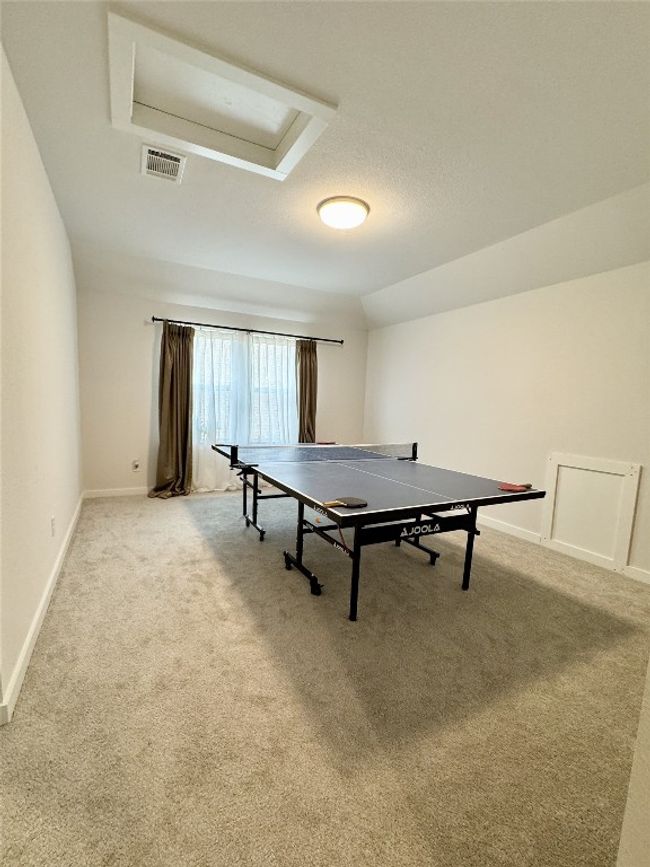 Game room with carpet, baseboards, and attic access | Image 7