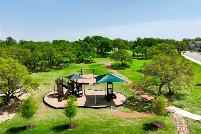 View of home's community with a yard and playground community | Image 38