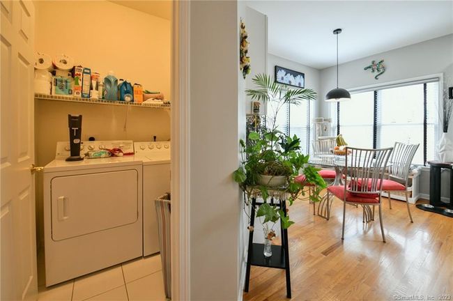 Come into the back hall from the garage and see the laundry on your left, just off the kitchen - handy! | Image 14