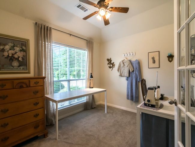 :Another view of the office/study with its double French doors and tray ceiling. | Image 5