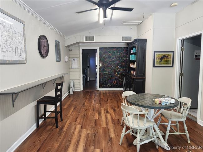 back room leading to main room with side door to currently stock room. | Image 17