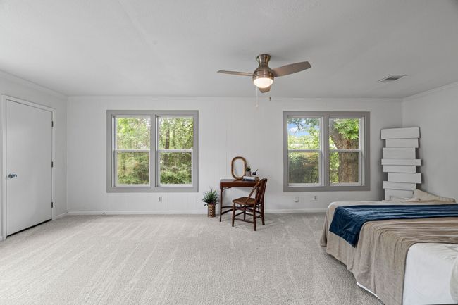 Carpeted bedroom with ornamental molding and ceiling fan | Image 14
